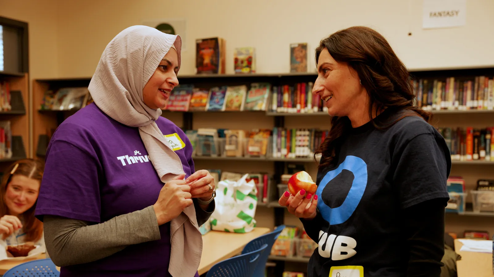 Two women talking at a Thrive Youth Day workshop